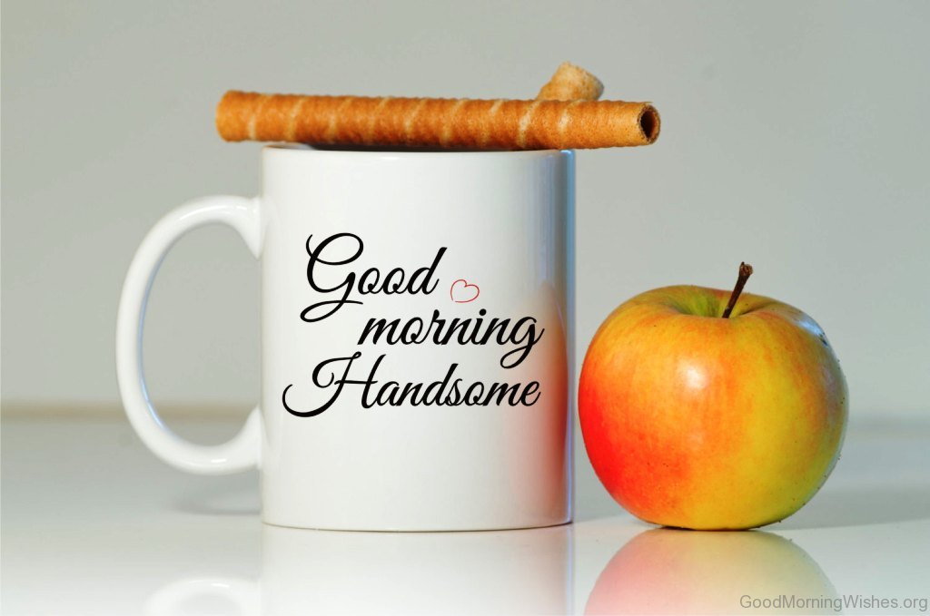 A coffee mug with a cinnamon stick and an Apple for him