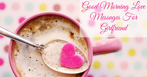 A pink coffee mug and a pink heart on a spoon