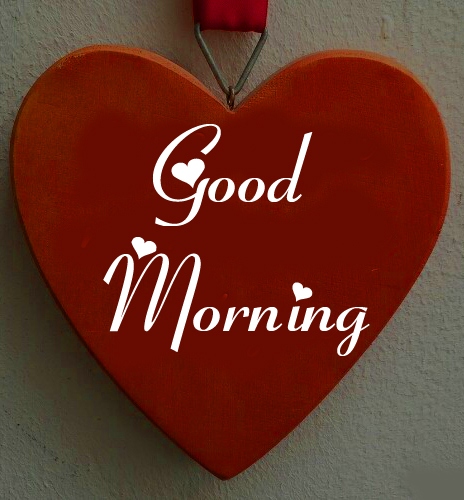 Red wooden heart on a ribbon with a good morning wish