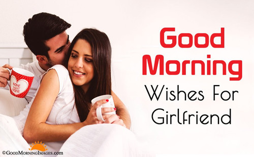 Guy with a girl in the morning in bed with coffee mugs