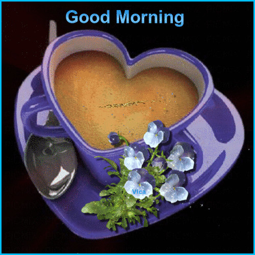 purple heart shaped mug with coffee and flowers