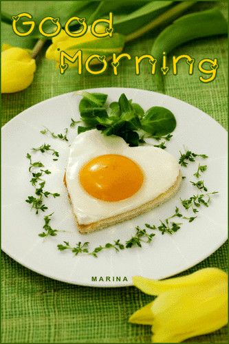 heart-shaped fried eggs with greens on a plate